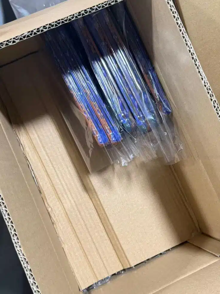 Protected ADIFA tins arranged in a carton